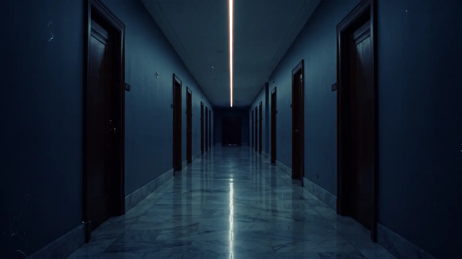 A long empty corridor in a federal building at night, lit by a single ceiling line.